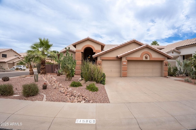 15809 S 31st St, Phoenix, AZ 85048 - mediterranean / spanish home featuring stucco siding, a garage, concrete driveway, and a tile roof