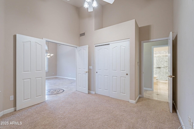 15809 S 31st St, Phoenix, AZ 85048 - unfurnished bedroom featuring a towering ceiling, carpet floors, a chandelier, and baseboards