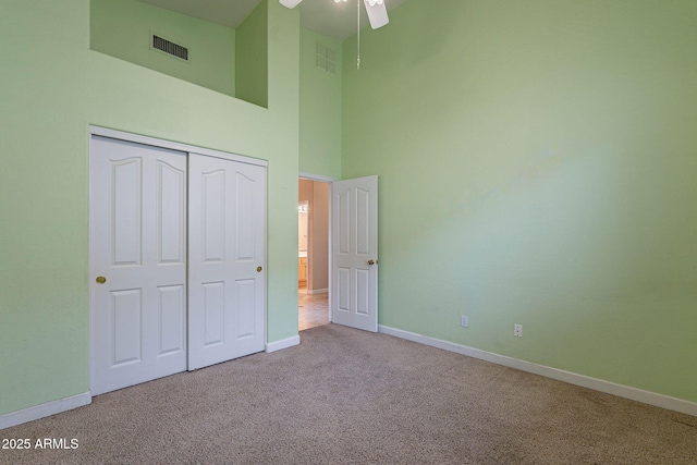 15809 S 31st St, Phoenix, AZ 85048 - unfurnished bedroom with carpet, baseboards, a high ceiling, and a closet