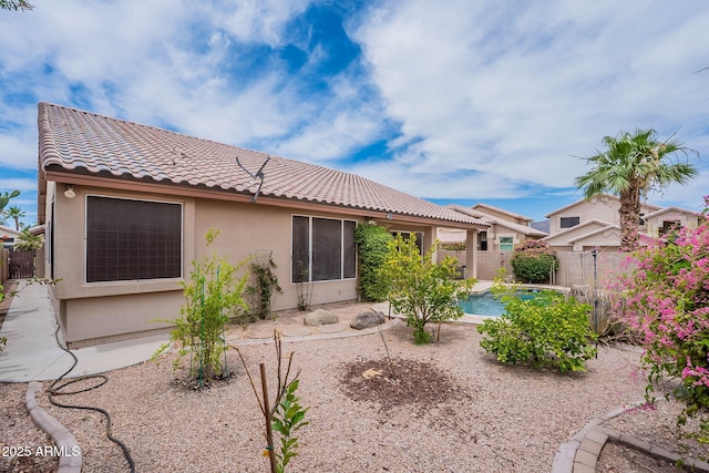 15809 S 31st St, Phoenix, AZ 85048 - back of house featuring a tile roof, stucco siding, a fenced backyard, and a patio