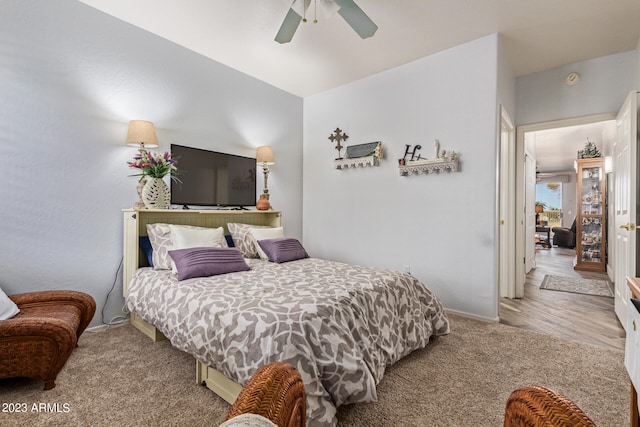 bedroom featuring light hardwood / wood-style floors and ceiling fan