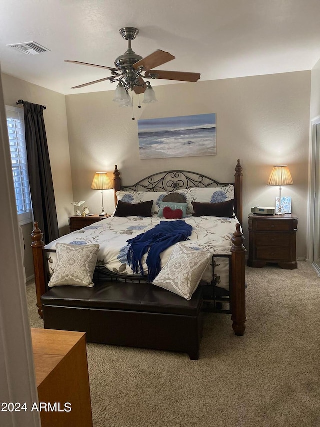 bedroom with ceiling fan and carpet flooring