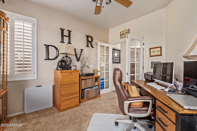 carpeted office space featuring ceiling fan and french doors