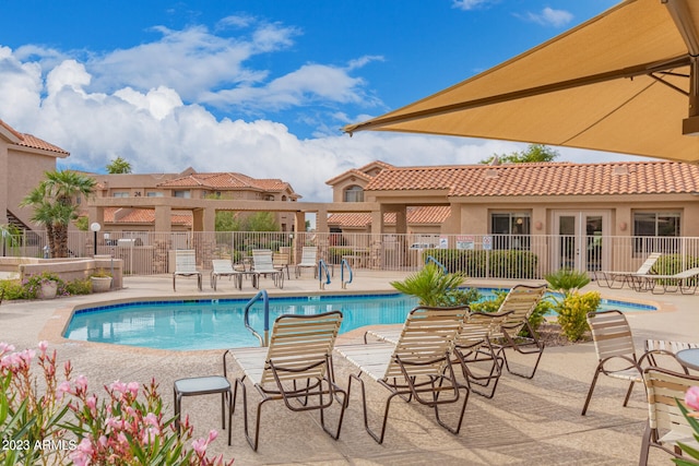 view of swimming pool with a patio