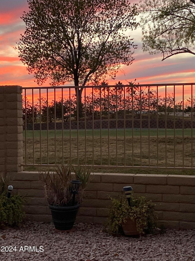 view of gate at dusk