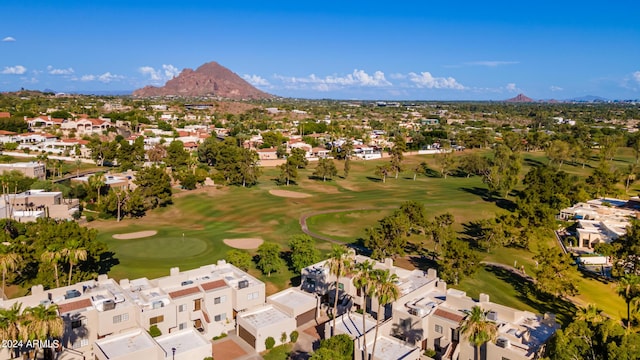 aerial view with view of golf course, a residential view, and a mountain view