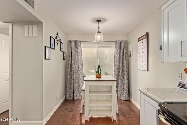 dining space with dark wood-style floors and baseboards