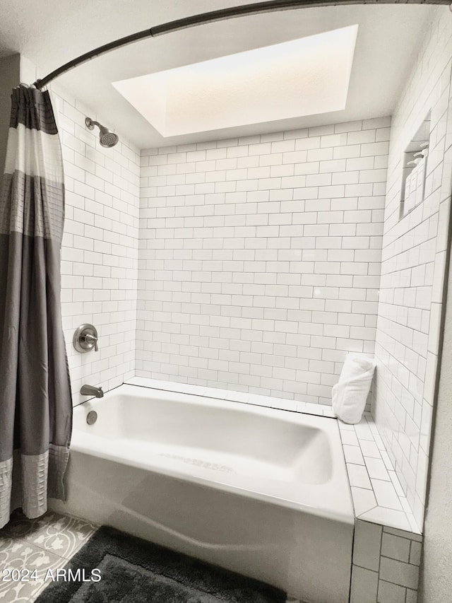 bathroom with shower / tub combo with curtain