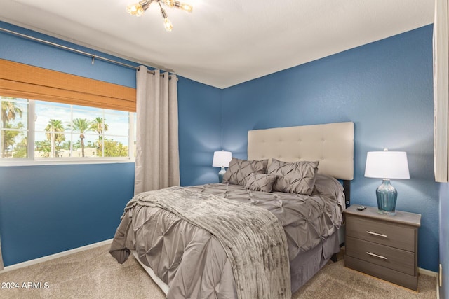 bedroom with carpet floors and baseboards