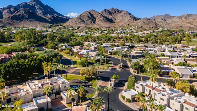 birds eye view of property with a mountain view and a residential view