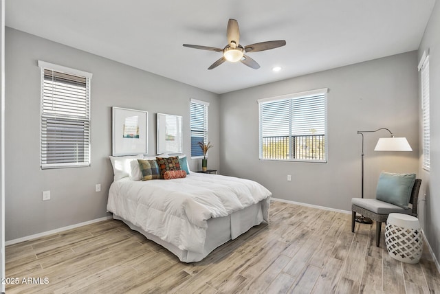 bedroom with light wood-type flooring and ceiling fan