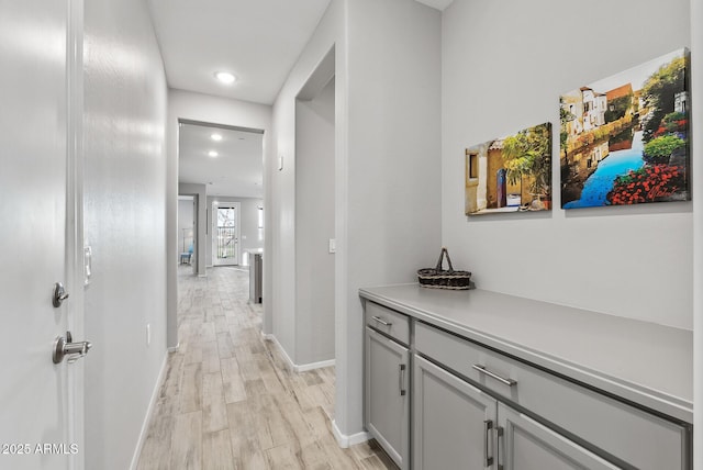 hallway featuring light wood-type flooring