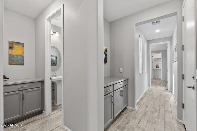 hallway with light wood-type flooring