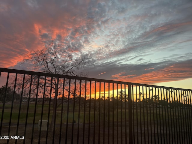 view of gate at dusk