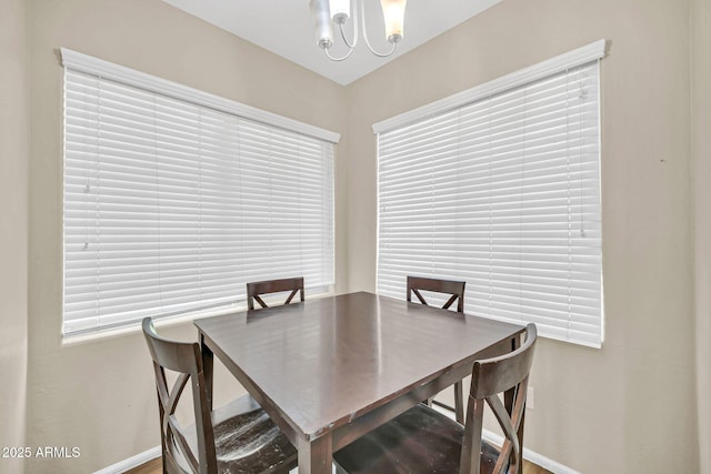 2118 N 77th Ln, Phoenix, AZ 85035 - dining room with baseboards and a chandelier
