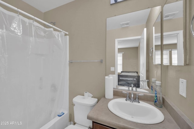 2118 N 77th Ln, Phoenix, AZ 85035 - bathroom featuring vanity, healthy amount of natural light, toilet, and shower / bath combination with curtain