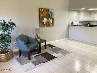 living area featuring light tile patterned floors