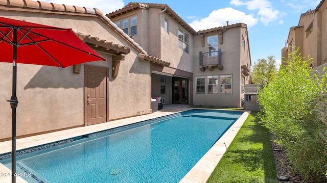 outdoor pool featuring a patio area