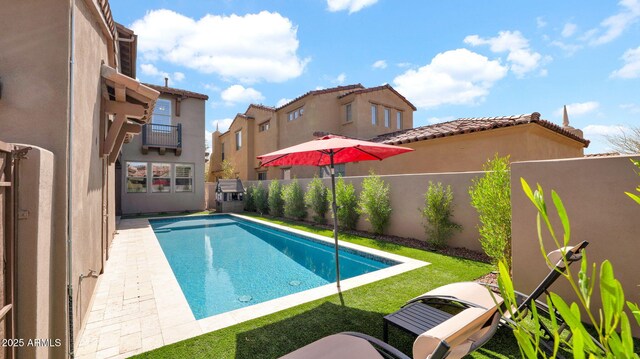 view of swimming pool featuring a patio area, a fenced backyard, and a fenced in pool