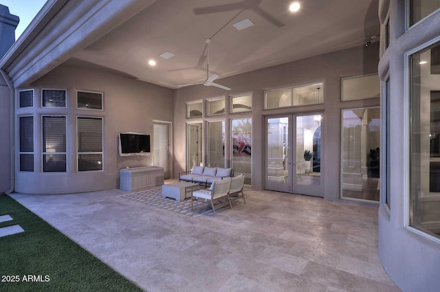 view of patio featuring an outdoor living space, ceiling fan, and french doors