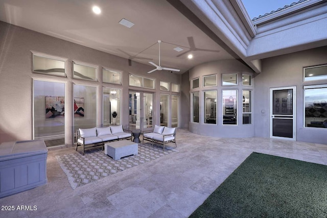 view of patio / terrace with ceiling fan and outdoor lounge area