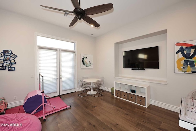 interior space featuring dark wood-type flooring and ceiling fan