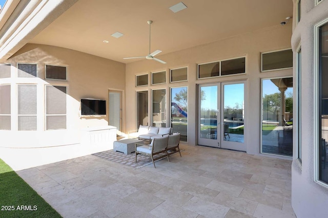 view of patio featuring ceiling fan