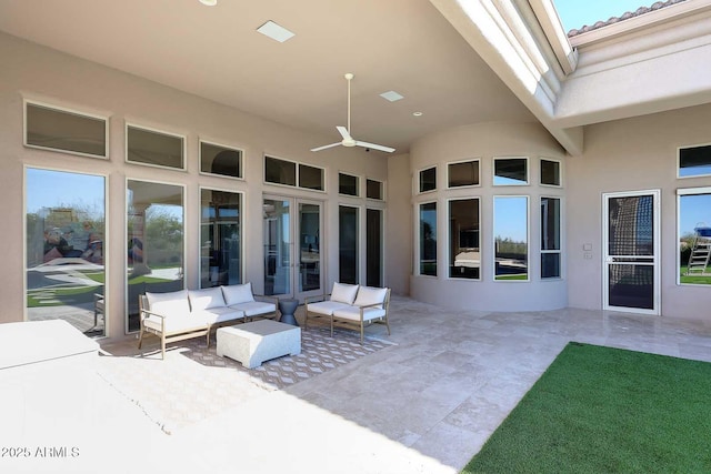 view of patio with ceiling fan and outdoor lounge area