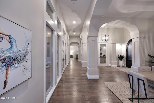 hallway with dark wood-type flooring