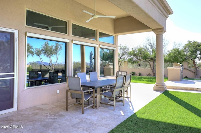 view of patio featuring ceiling fan