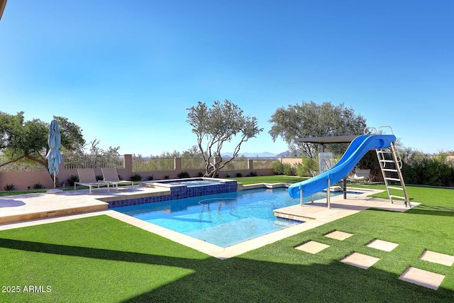 view of pool featuring an in ground hot tub, a patio area, a yard, and a water slide