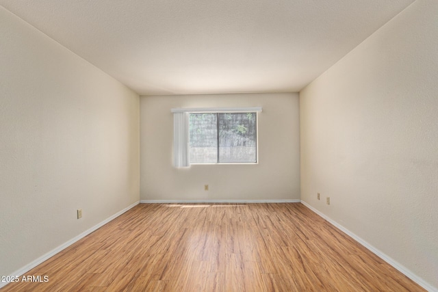 2164 S Estrella Cir, Mesa, AZ 85202 - unfurnished room with light wood finished floors and baseboards