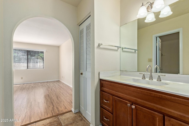 2164 S Estrella Cir, Mesa, AZ 85202 - bathroom featuring a chandelier, vanity, and a closet