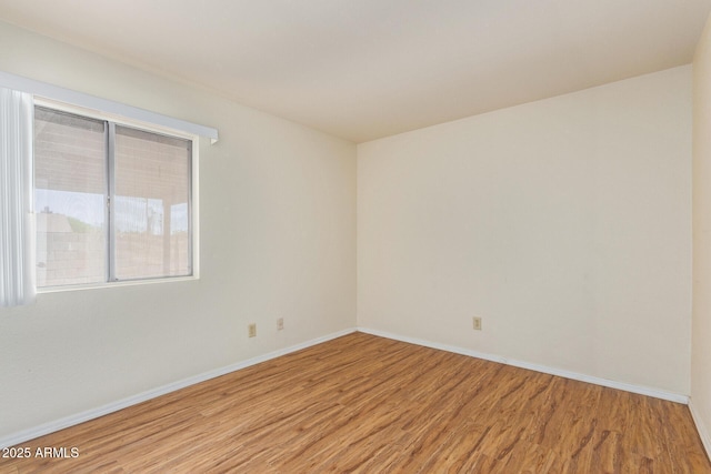 2164 S Estrella Cir, Mesa, AZ 85202 - unfurnished room featuring wood finished floors and baseboards