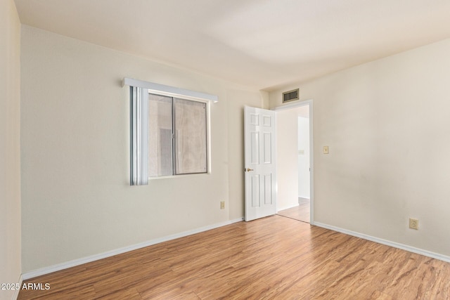 2164 S Estrella Cir, Mesa, AZ 85202 - empty room with wood finished floors and baseboards