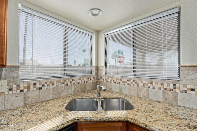 2164 S Estrella Cir, Mesa, AZ 85202 - kitchen view of backsplash, light stone counters, and brown cabinets