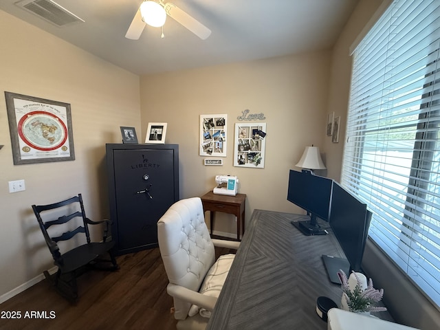 office space featuring baseboards, visible vents, wood finished floors, and ceiling fan