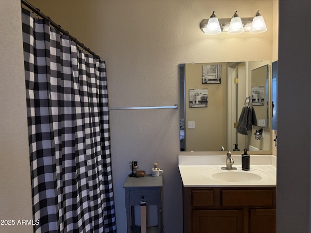 bathroom featuring vanity and a shower with curtain