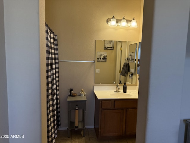 bathroom with curtained shower, tile patterned flooring, and vanity