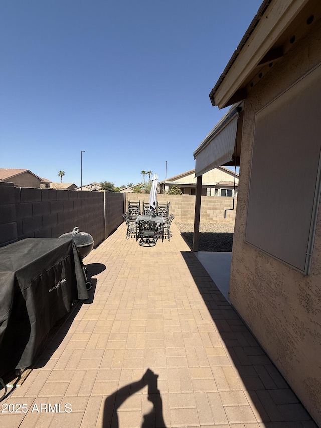 view of patio / terrace featuring outdoor dining area and a fenced backyard