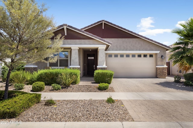 10165 E Gamma Ave, Mesa, AZ 85212 - craftsman-style home featuring a garage, stucco siding, decorative driveway, and a tiled roof