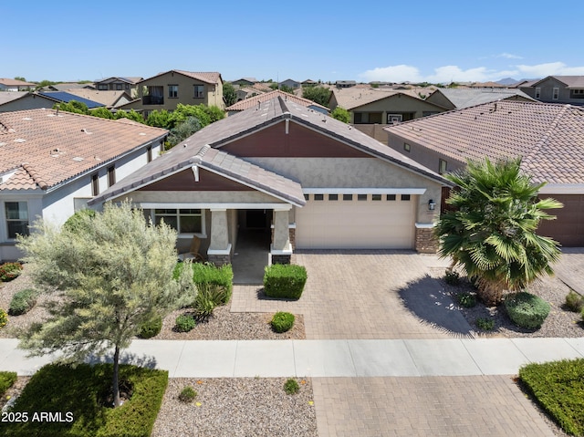 10165 E Gamma Ave, Mesa, AZ 85212 - view of front facade featuring a residential view, a garage, decorative driveway, and stucco siding