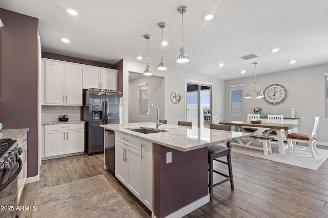 10165 E Gamma Ave, Mesa, AZ 85212 - kitchen with refrigerator with ice dispenser, dishwasher, recessed lighting, dark wood-type flooring, and stove