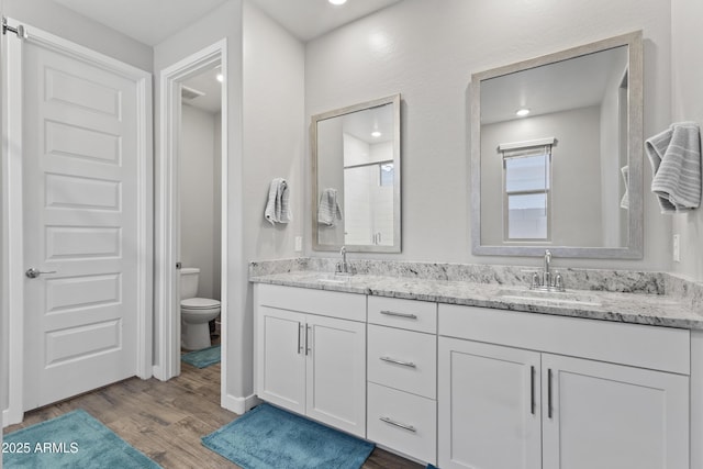 10165 E Gamma Ave, Mesa, AZ 85212 - full bathroom with double vanity, wood finished floors, recessed lighting, and a shower