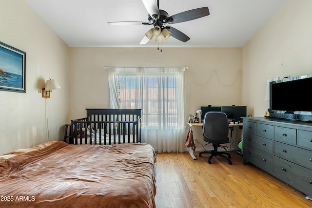 bedroom with ceiling fan and light hardwood / wood-style flooring