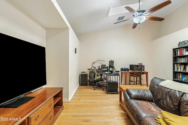 living room featuring vaulted ceiling, ceiling fan, and light wood-type flooring