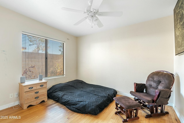 bedroom with hardwood / wood-style flooring and ceiling fan