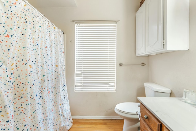 bathroom with vanity, hardwood / wood-style floors, toilet, and a shower with shower curtain