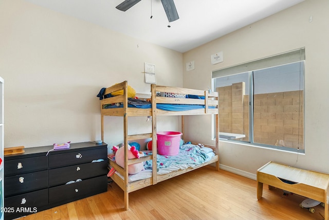 bedroom with wood-type flooring and ceiling fan