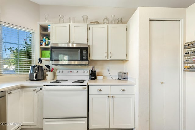 kitchen featuring white cabinets and appliances with stainless steel finishes